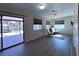 Gathering room with sliding glass doors and wood-look floors at 1196 Hinton St, Port Charlotte, FL 33952