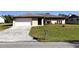 Single Gathering home with attached garage and mailbox at 1196 Hinton St, Port Charlotte, FL 33952