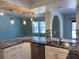 Updated kitchen with granite countertops and stylish pendant lighting at 1196 Hinton St, Port Charlotte, FL 33952
