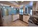 Modern kitchen with granite island and stainless steel appliances at 1196 Hinton St, Port Charlotte, FL 33952