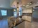 Modern kitchen featuring granite counters and stainless steel appliances at 1196 Hinton St, Port Charlotte, FL 33952