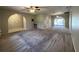 Spacious living room with neutral carpeting and access to other rooms at 1196 Hinton St, Port Charlotte, FL 33952