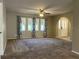 Living room with carpet and neutral walls, view to entryway at 1196 Hinton St, Port Charlotte, FL 33952