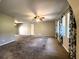 Spacious living room with carpeted floors and large windows at 1196 Hinton St, Port Charlotte, FL 33952