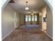 Open living area with neutral colored walls and carpeting at 1196 Hinton St, Port Charlotte, FL 33952