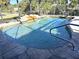 Inviting swimming pool with waterfall feature at 1196 Hinton St, Port Charlotte, FL 33952