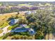 Aerial view showcasing home's location, backyard, and screened enclosure at 17513 Pomegrante Way, Punta Gorda, FL 33955