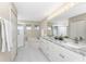 Spacious bathroom with granite countertops and a large soaking tub at 17513 Pomegrante Way, Punta Gorda, FL 33955