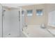 Bathroom with walk-in shower and soaking tub at 17513 Pomegrante Way, Punta Gorda, FL 33955