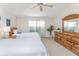 Two twin beds in a well-lit bedroom with wood furniture at 17513 Pomegrante Way, Punta Gorda, FL 33955
