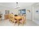 Bright dining room featuring a wood table and six chairs at 17513 Pomegrante Way, Punta Gorda, FL 33955