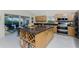 Modern kitchen with island, granite countertops, and stainless steel appliances at 17513 Pomegrante Way, Punta Gorda, FL 33955