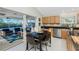 Eat-in kitchen with sliders leading to the pool area and a breakfast nook at 17513 Pomegrante Way, Punta Gorda, FL 33955