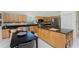 Well-equipped kitchen boasting granite counters, stainless steel appliances & island at 17513 Pomegrante Way, Punta Gorda, FL 33955