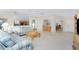 Open concept living space with a view into the kitchen and dining area at 17513 Pomegrante Way, Punta Gorda, FL 33955