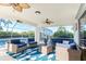 Spacious lanai with pool and comfortable seating area at 17513 Pomegrante Way, Punta Gorda, FL 33955