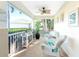 Relaxing screened porch with wicker chairs and ceiling fan at 17513 Pomegrante Way, Punta Gorda, FL 33955