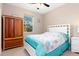 Bright bedroom with a queen-size bed and wood armoire at 1762 Foxglove Ave, North Port, FL 34288