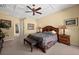 Large bedroom with king bed and access to bathroom at 1849 Bobcat Trl, North Port, FL 34288