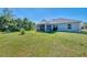 Large backyard with screened porch at 1858 Capitol St, North Port, FL 34288