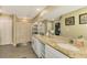 Elegant bathroom with double vanity, granite countertop, and walk-in shower at 1858 Capitol St, North Port, FL 34288