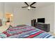 Bright bedroom featuring a large bed, dresser, and ensuite bathroom access at 1858 Capitol St, North Port, FL 34288