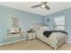 Bedroom with light blue walls, a desk, and coastal-themed decor at 1858 Capitol St, North Port, FL 34288