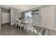 Dining area featuring a light wood table and six chairs at 1858 Capitol St, North Port, FL 34288