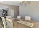 Dining room with wood table, and access to the kitchen at 1858 Capitol St, North Port, FL 34288