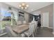 Bright dining room with wood table and neutral decor at 1858 Capitol St, North Port, FL 34288