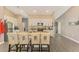 Eat-in kitchen with island and light beige cabinets at 1858 Capitol St, North Port, FL 34288