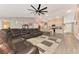 Open living area with sectional sofa, kitchen, and high ceilings at 1858 Capitol St, North Port, FL 34288