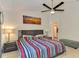 Spacious main bedroom with king-size bed and ensuite bathroom at 1858 Capitol St, North Port, FL 34288