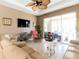 Living room with sectional sofa and ceiling fan at 24488 Riverfront Dr, Punta Gorda, FL 33980