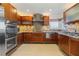 Modern kitchen with stainless steel appliances and granite counters at 25380 Vantage Ln, Punta Gorda, FL 33983