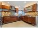 Modern kitchen with granite countertops and wood cabinetry at 25380 Vantage Ln, Punta Gorda, FL 33983
