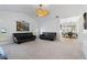 Open living room with vaulted ceiling and view to kitchen at 25380 Vantage Ln, Punta Gorda, FL 33983