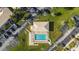 Overhead community pool view, displaying the layout and proximity to parking and landscaping at 26485 Rampart Blvd # E7, Punta Gorda, FL 33983