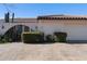 House exterior featuring arched entry and mature shrubs at 3041 Clifford St, Punta Gorda, FL 33980