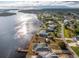 Aerial view of waterfront home with pool and dock at 3220 Peace River Dr, Punta Gorda, FL 33983