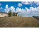 Large backyard with waterfront access and fenced area at 3220 Peace River Dr, Punta Gorda, FL 33983