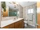 Bathroom with light vanity and a separate shower at 3220 Peace River Dr, Punta Gorda, FL 33983