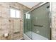Bathroom with shower/tub combo and bamboo wallpaper at 3220 Peace River Dr, Punta Gorda, FL 33983