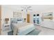 Main bedroom with water views and light blue bed frame at 3220 Peace River Dr, Punta Gorda, FL 33983
