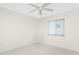 Spacious bedroom with ceiling fan and tile flooring at 3220 Peace River Dr, Punta Gorda, FL 33983