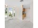 Open floor plan with view of kitchen and front door. Lots of natural light at 3220 Peace River Dr, Punta Gorda, FL 33983