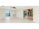 Bright living room with tile floors and sliding doors at 3220 Peace River Dr, Punta Gorda, FL 33983