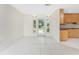 Open floor plan with view of kitchen and front door. Lots of natural light at 3220 Peace River Dr, Punta Gorda, FL 33983