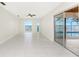 Spacious living room with tile floors and access to a patio at 3220 Peace River Dr, Punta Gorda, FL 33983