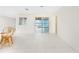 Bright, open floor plan with tile and sliding glass doors leading to the lanai at 3220 Peace River Dr, Punta Gorda, FL 33983